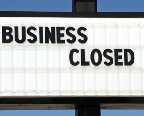 A sign indicates that a business is closed